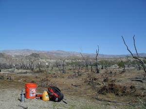 Orange bucket for hand washing and one of our work sites. 