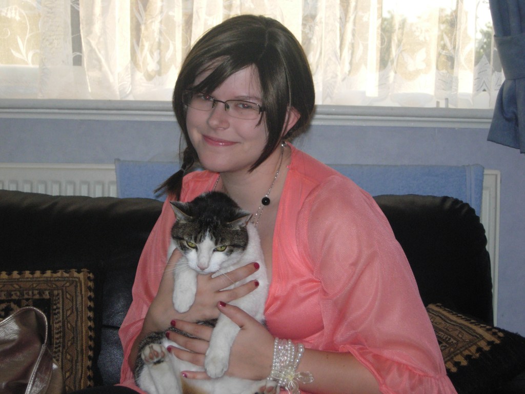 An old photo taken about 4 years ago with my cat Taffi and my wig (which didn't have a name). It was fun being a brunette.